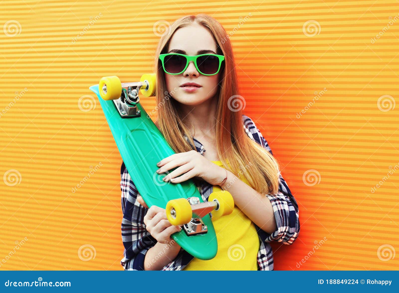 Portrait Young Blonde Woman with Green Skateboard Wearing a Sunglasses ...