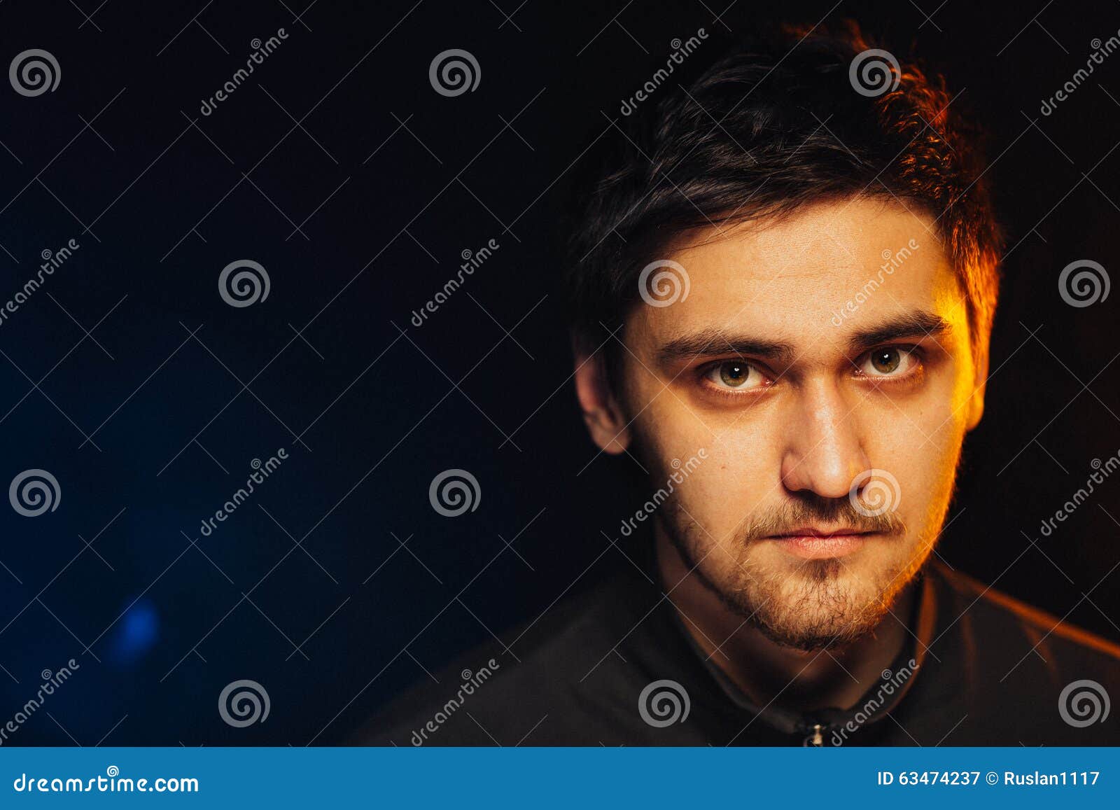 Portrait of a Young Brutal Man on Black Background Stock Image - Image ...