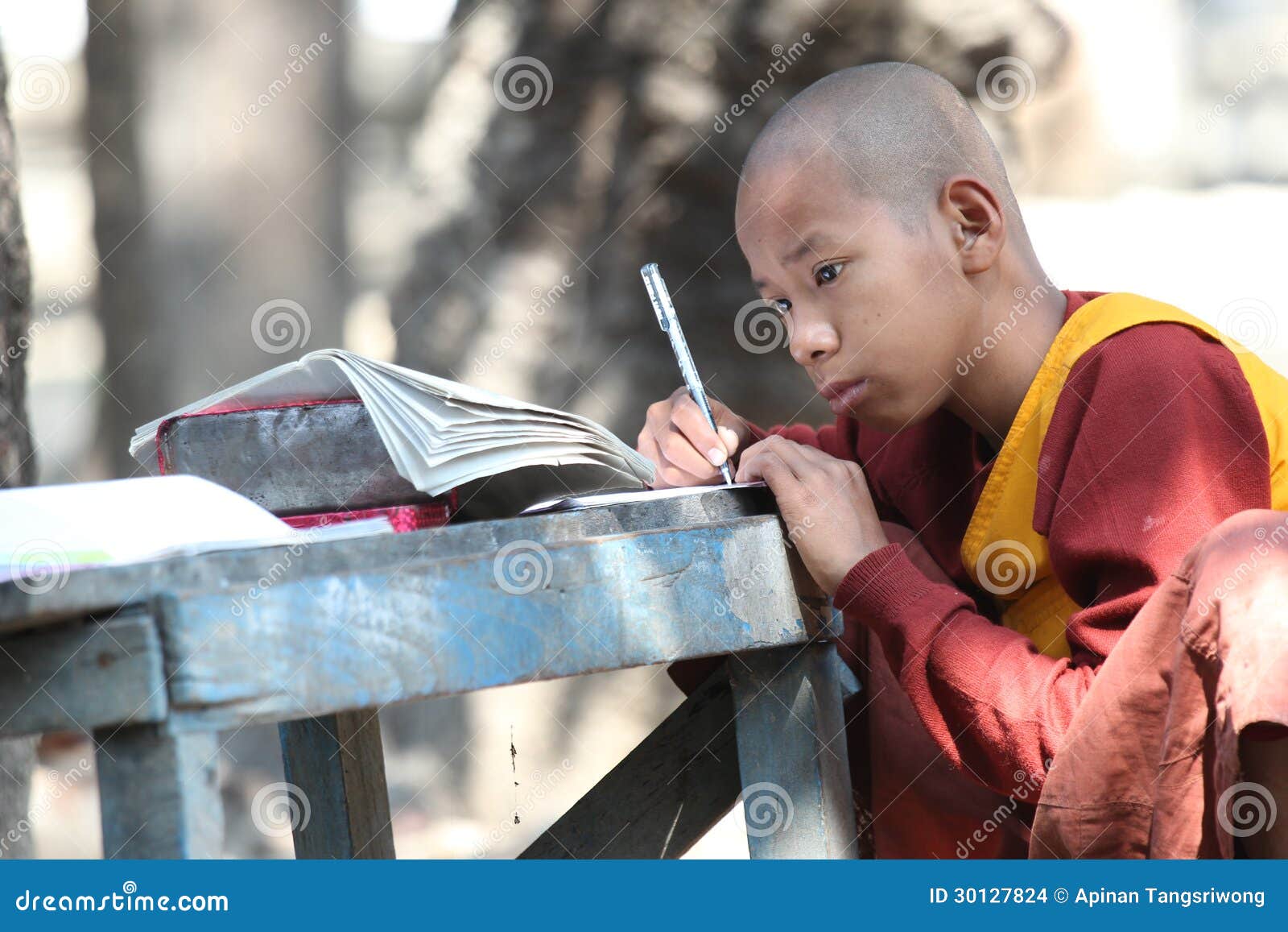 Monk writing in a book editorial stock image. Image of faith