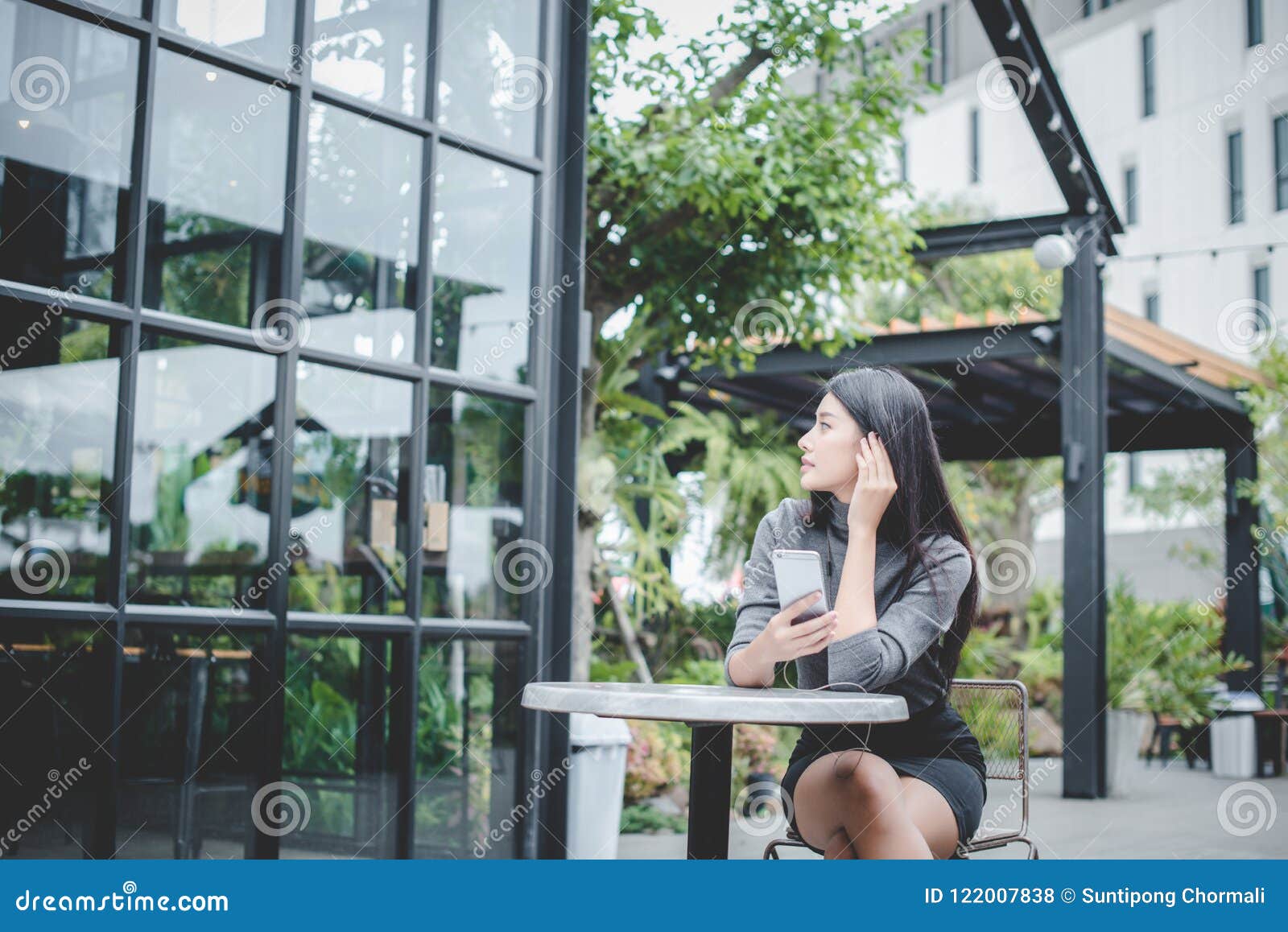 Portrait of Young Businesswoman Use Mobile Phone while Sitting I Stock ...
