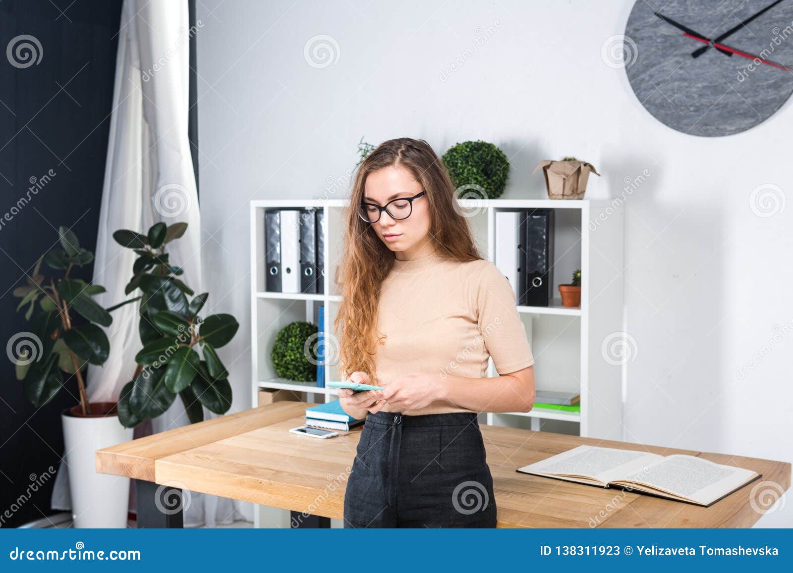 Portrait Of A Young Caucasian Woman With Long Hair And Glasses For