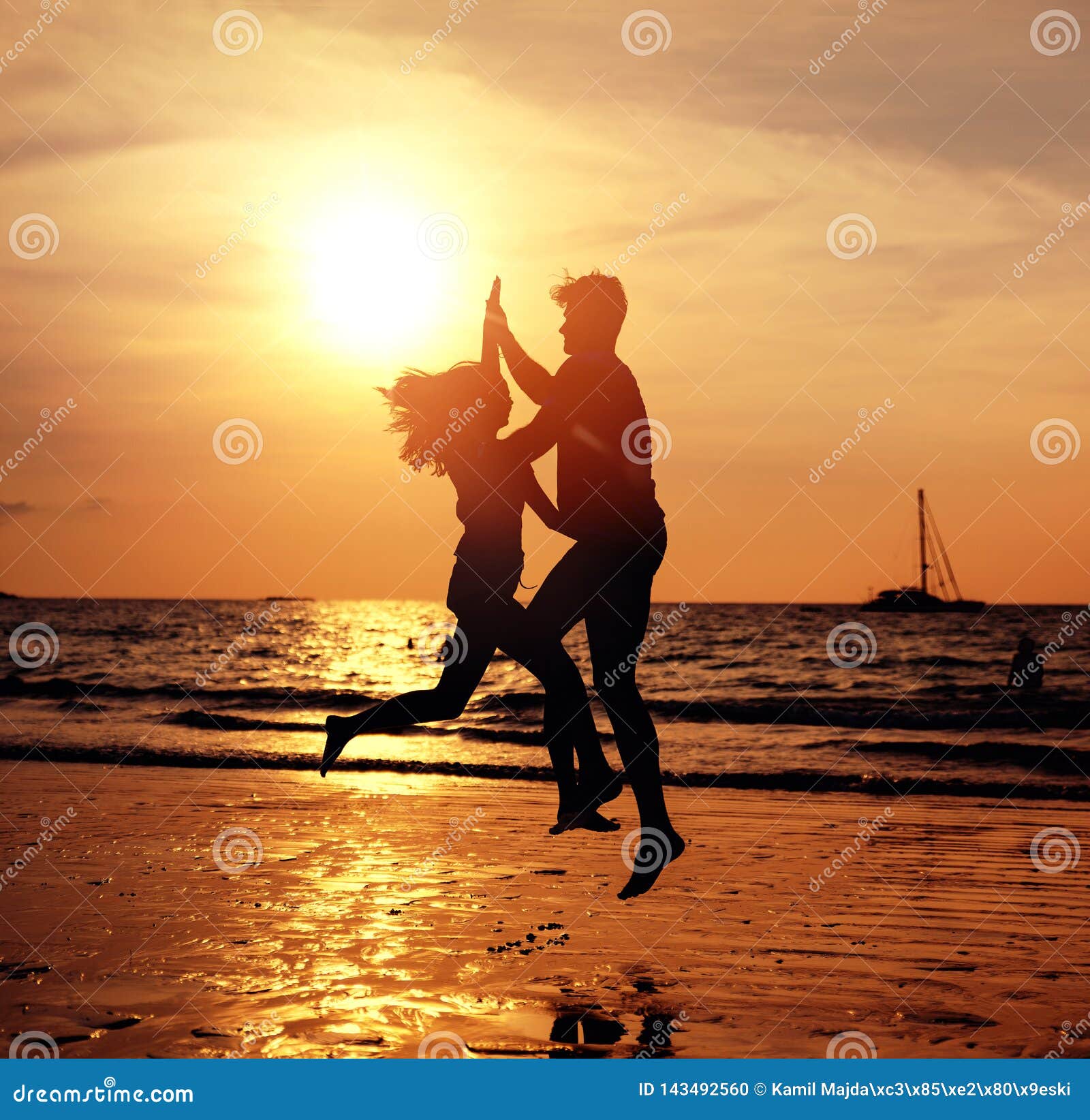 Portrait Of A Young Couple On The Tropical Beach Posing On Sunset Background Stock Photo Image Of Beautiful Male 143492560