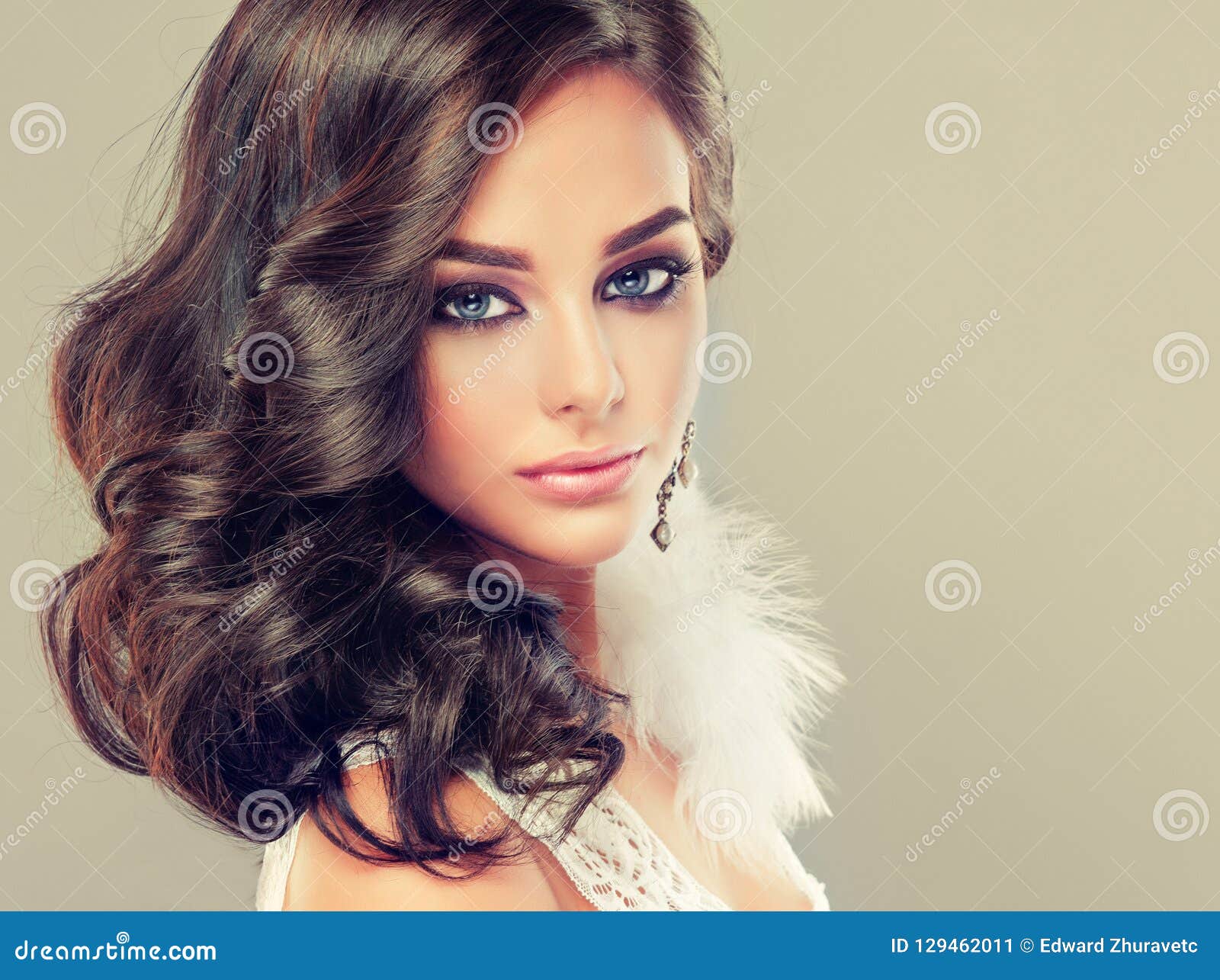 Portrait of Young Curly Haired Brunette with Vivid Eastern Style Make ...