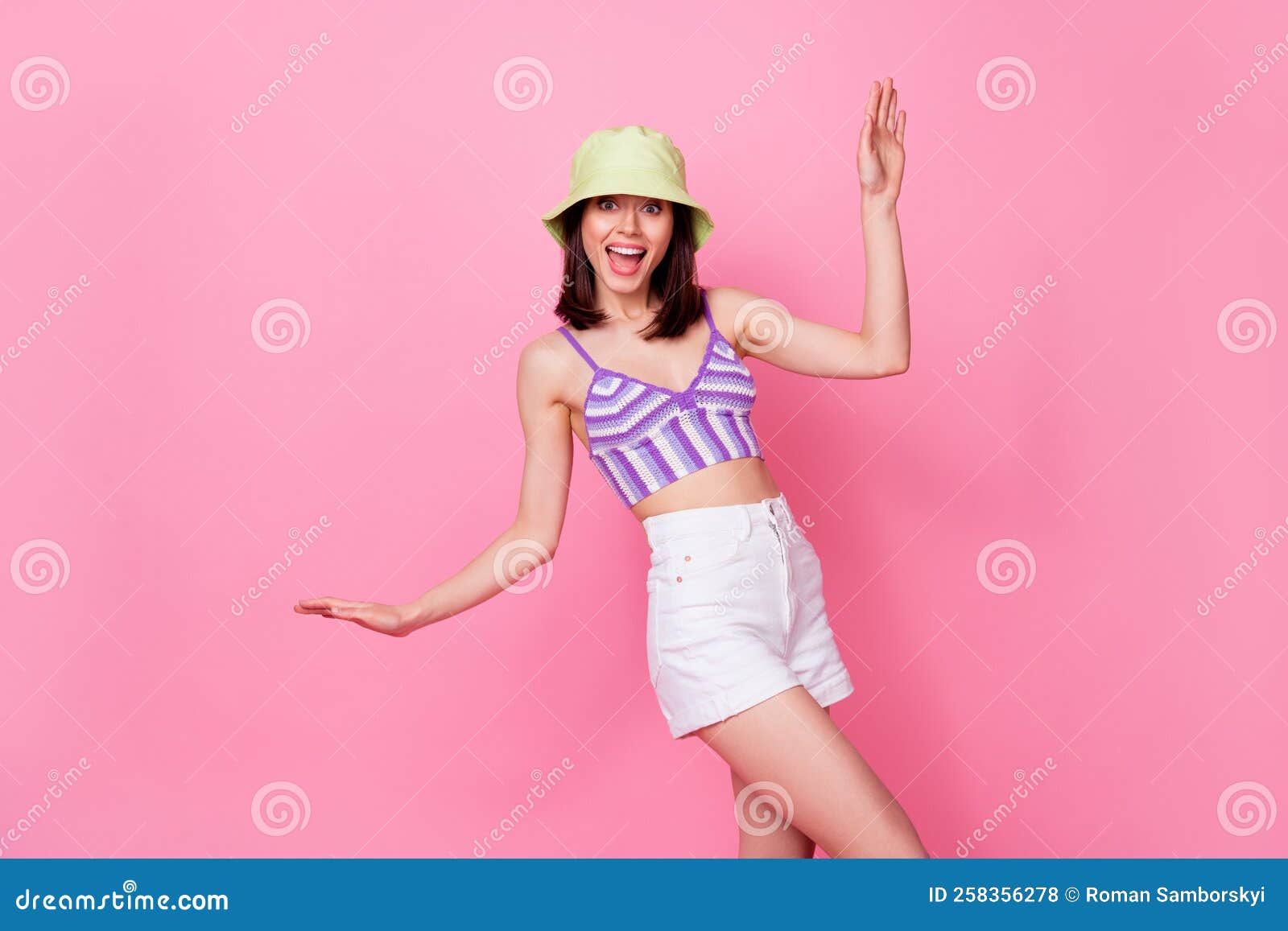 portrait of young dancing funny lady wear cute cap mini shorts party summer chill disco drunk  on pink color