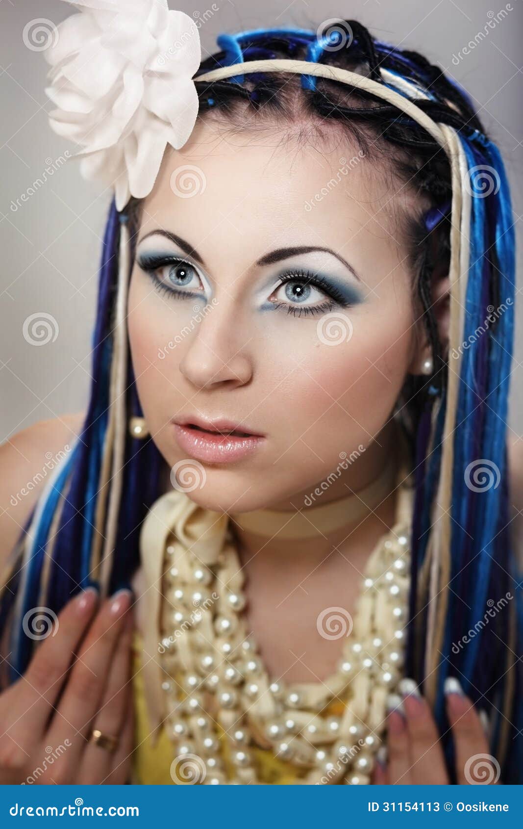 Portrait Of Young Female With Blue And White Dreadlocks