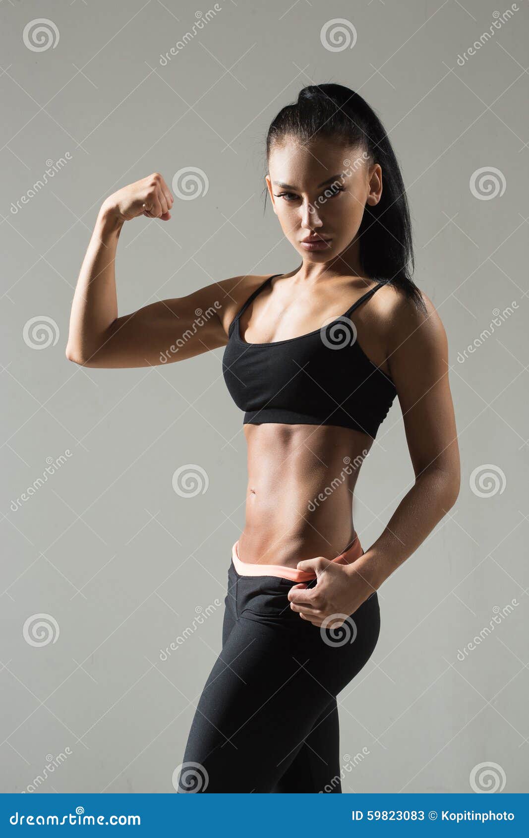 Portrait of Young Fitness Woman Shows Biceps Stock Image - Image of  athlete, athletic: 59823083