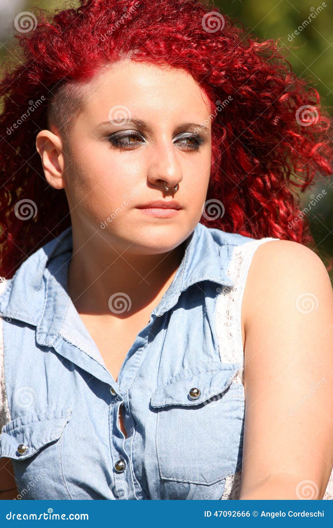 Portrait Of A Young Girl With Red Curly Hair And Piercing 