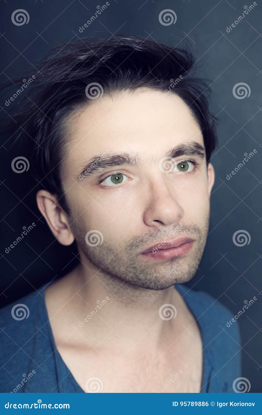 Portrait Of Young Green-eyed Man With Bristles On His Face Stock Photo ...