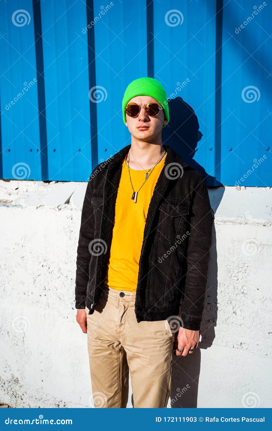 Portrait Young Guy in the Modern City with a Stylish Hat and Blue ...