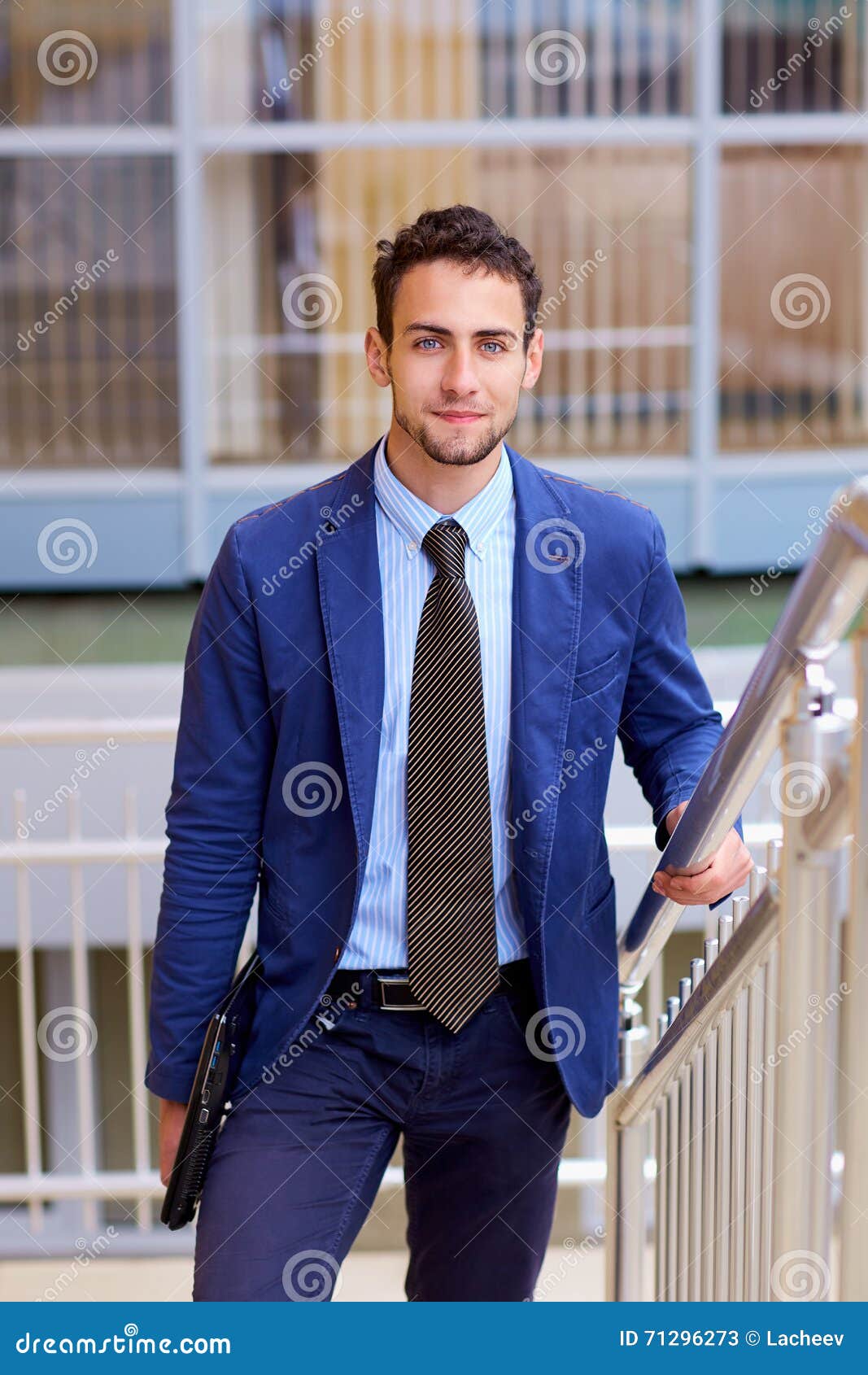 Portrait of a Young Handsome Business Man with Laptop. Stock Image ...