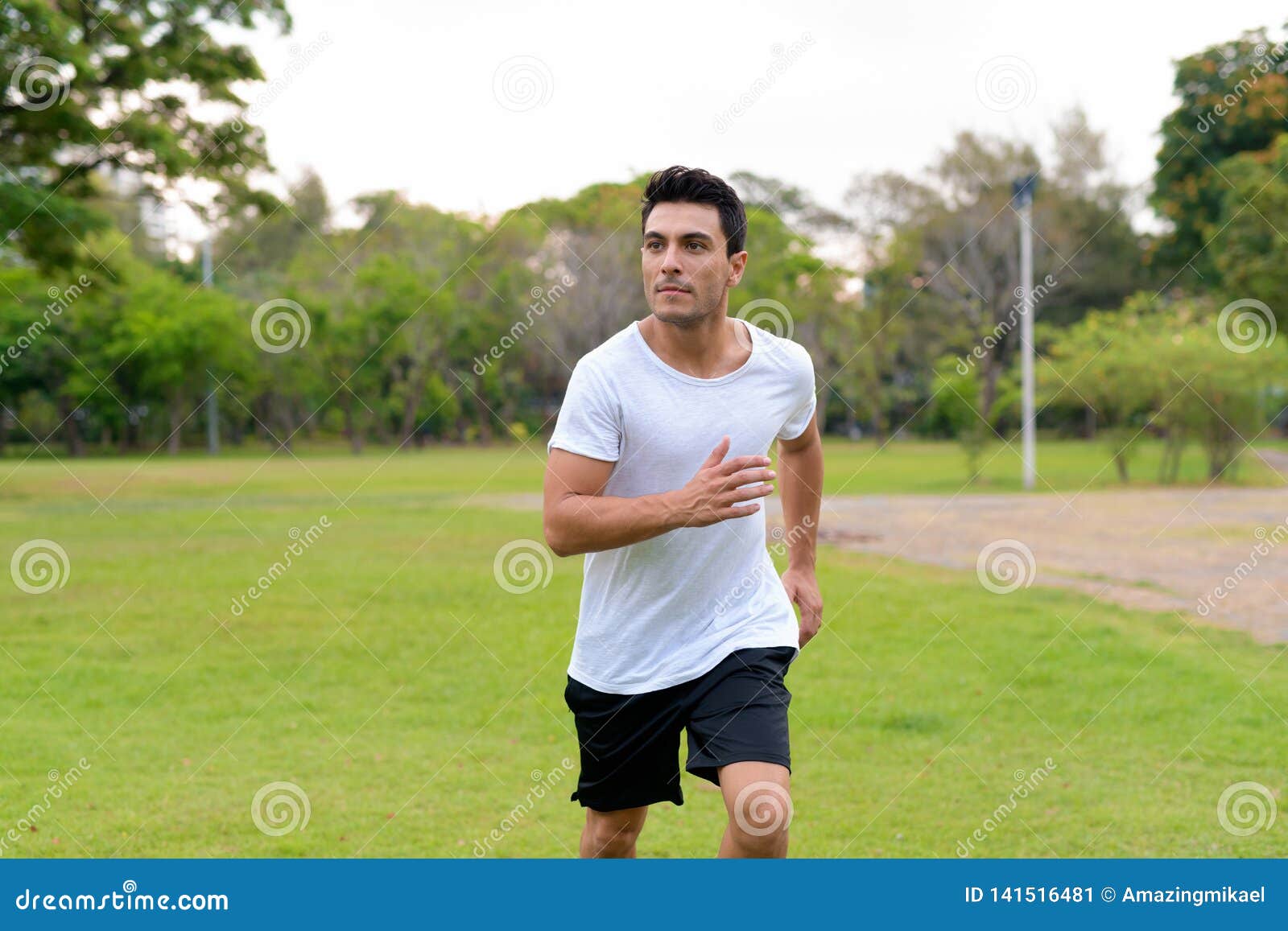 Young Handsome Hispanic Man Jogging in the Park Outdoors Stock Image ...