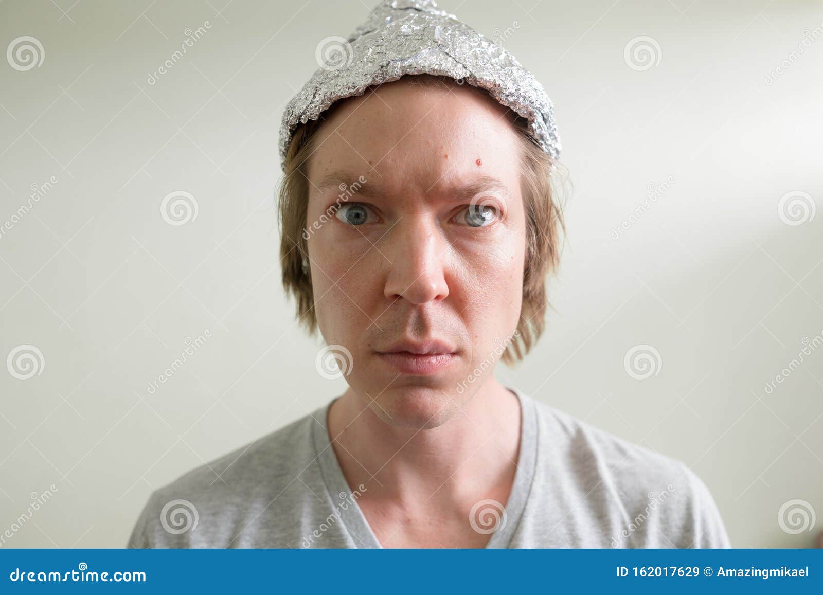 https://thumbs.dreamstime.com/z/portrait-young-handsome-man-wearing-tin-foil-hat-as-conspiracy-theory-concept-bedroom-home-face-young-man-wearing-162017629.jpg