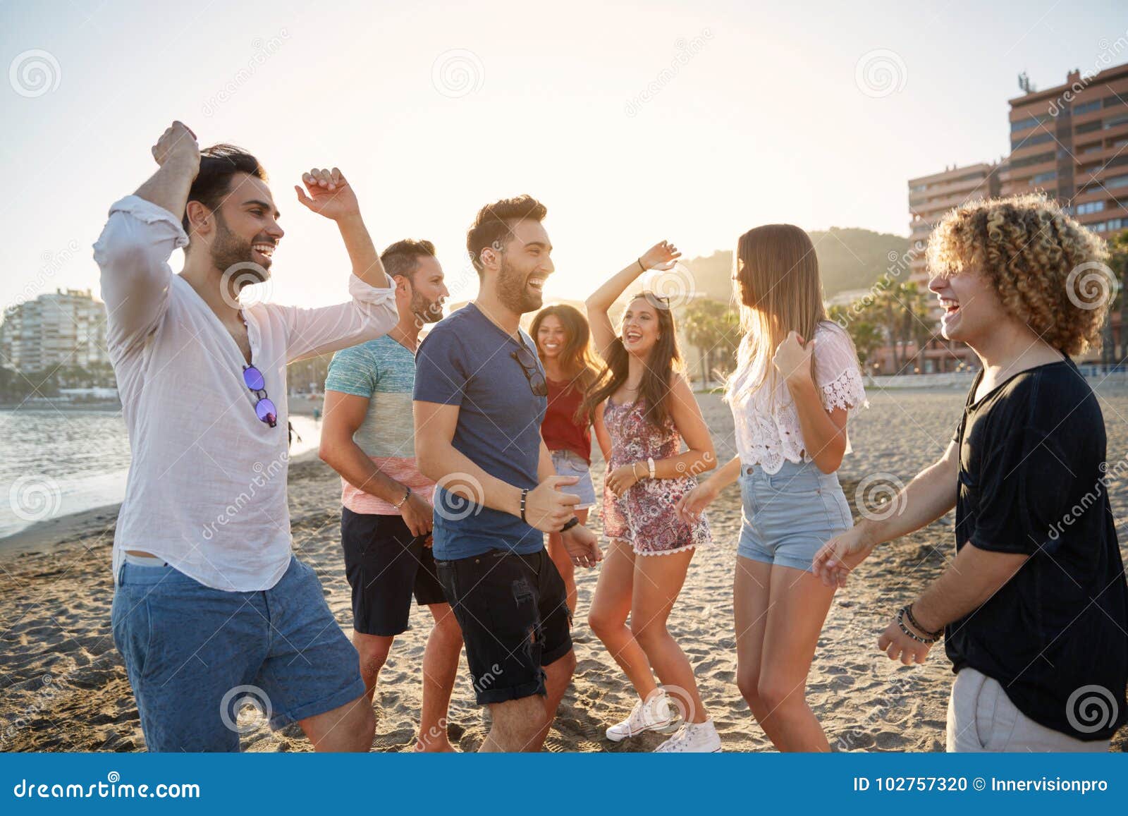 Young Happy People Partying on Beach Stock Photo - Image of male, group ...