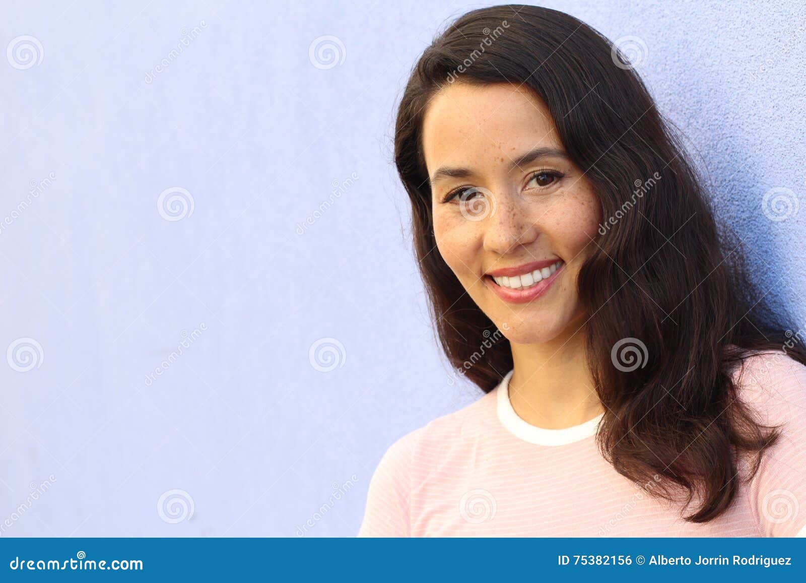 Portrait Of A Young Hispanic Female Smiling With Copy Space Stock Photo