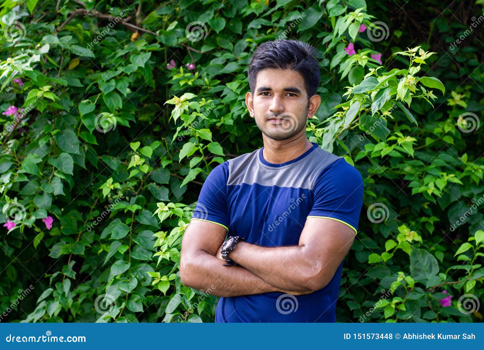 Portrait of Young Indian Man in Park on Green Background Stock Photo -  Image of autumn, fashion: 151573448