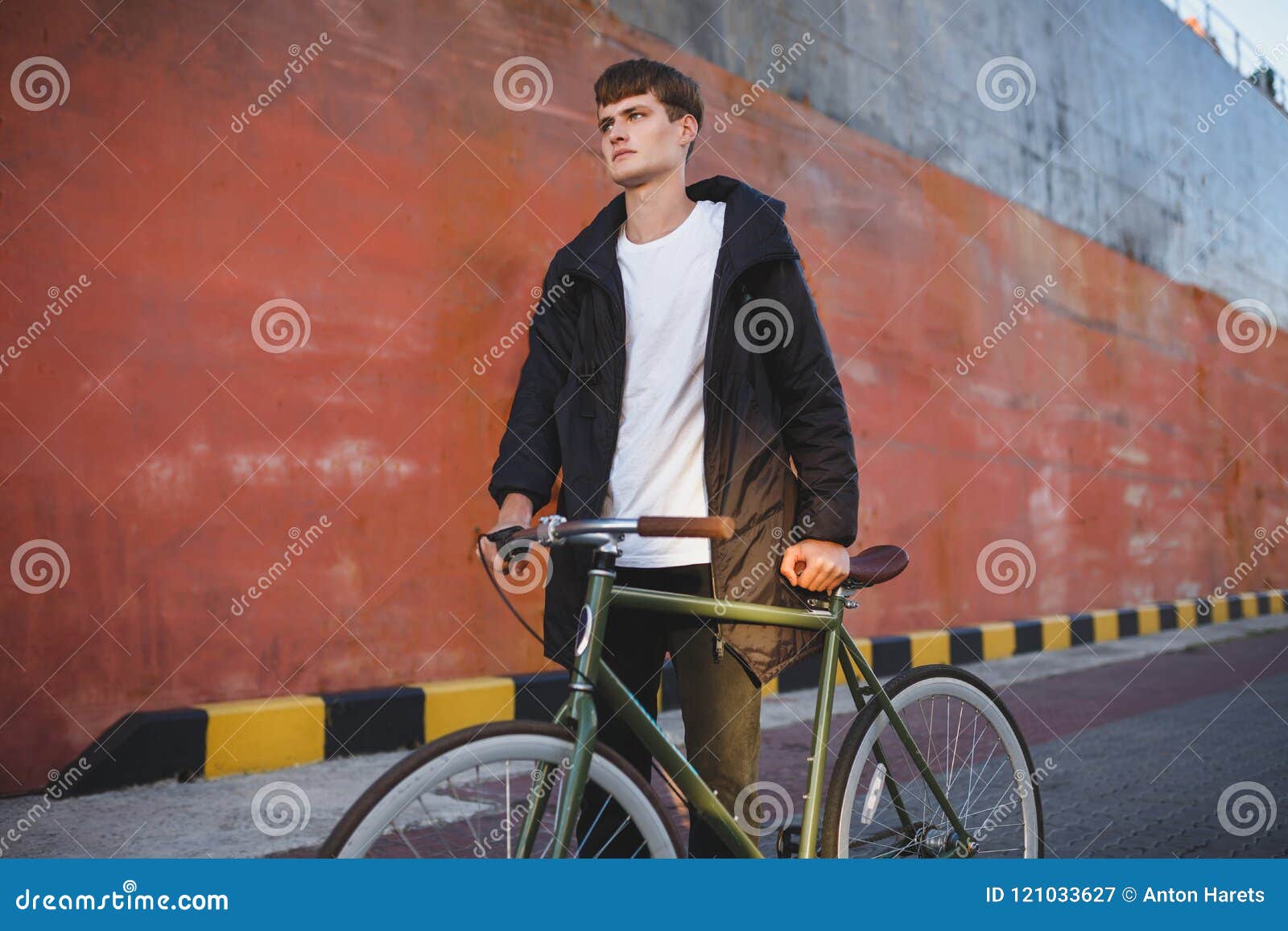 Young Man with Brown Hair Walking with Classic Bicycle while ...