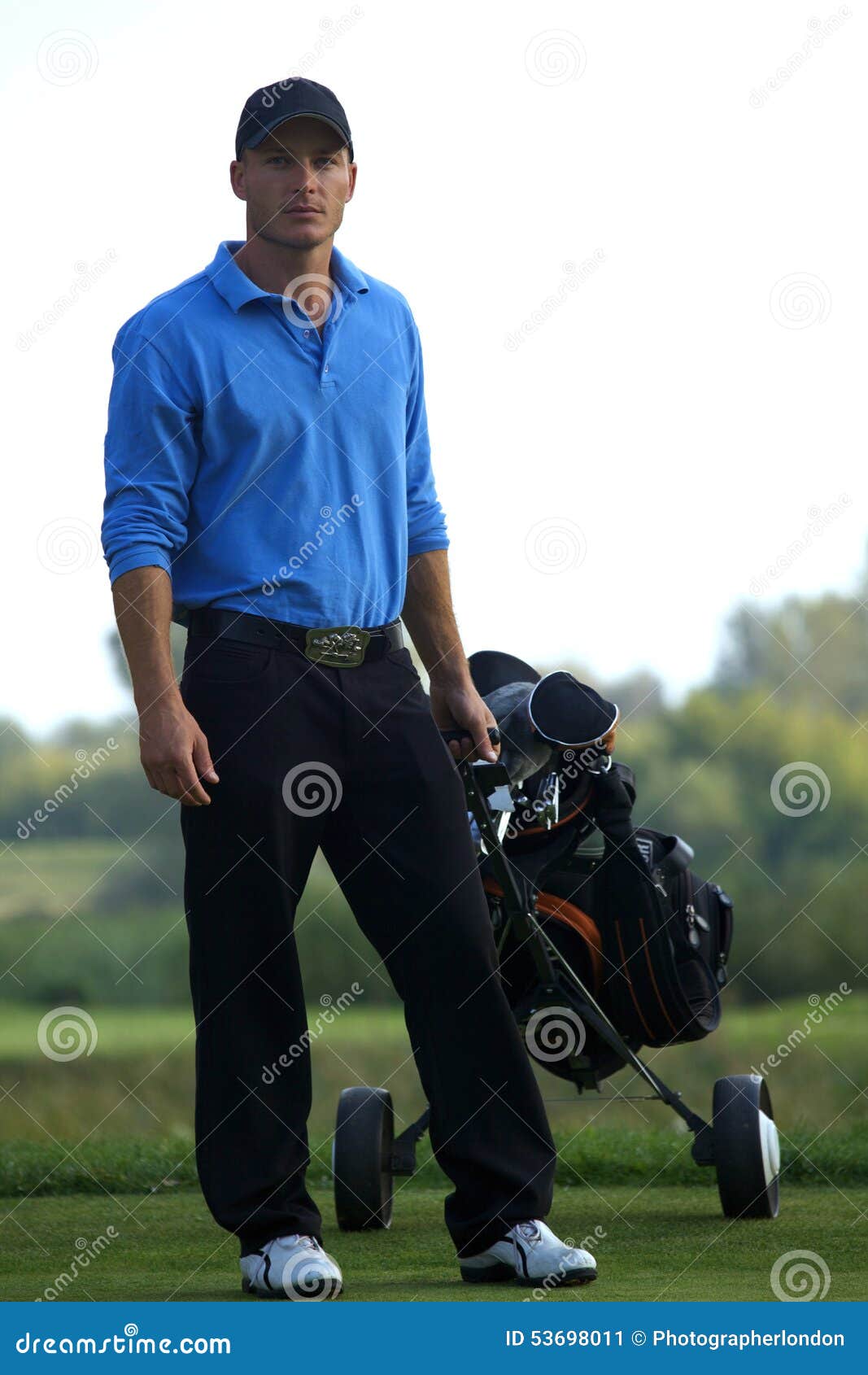 Portrait of Young Man Carrying Trolley with Golf Bag Stock Image ...