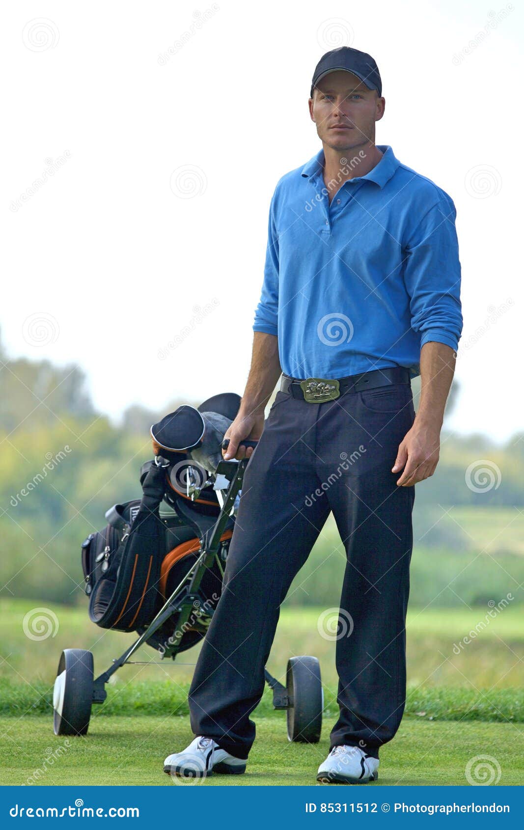 Portrait of Young Man Carrying Trolley with Golf Bag Stock Photo ...