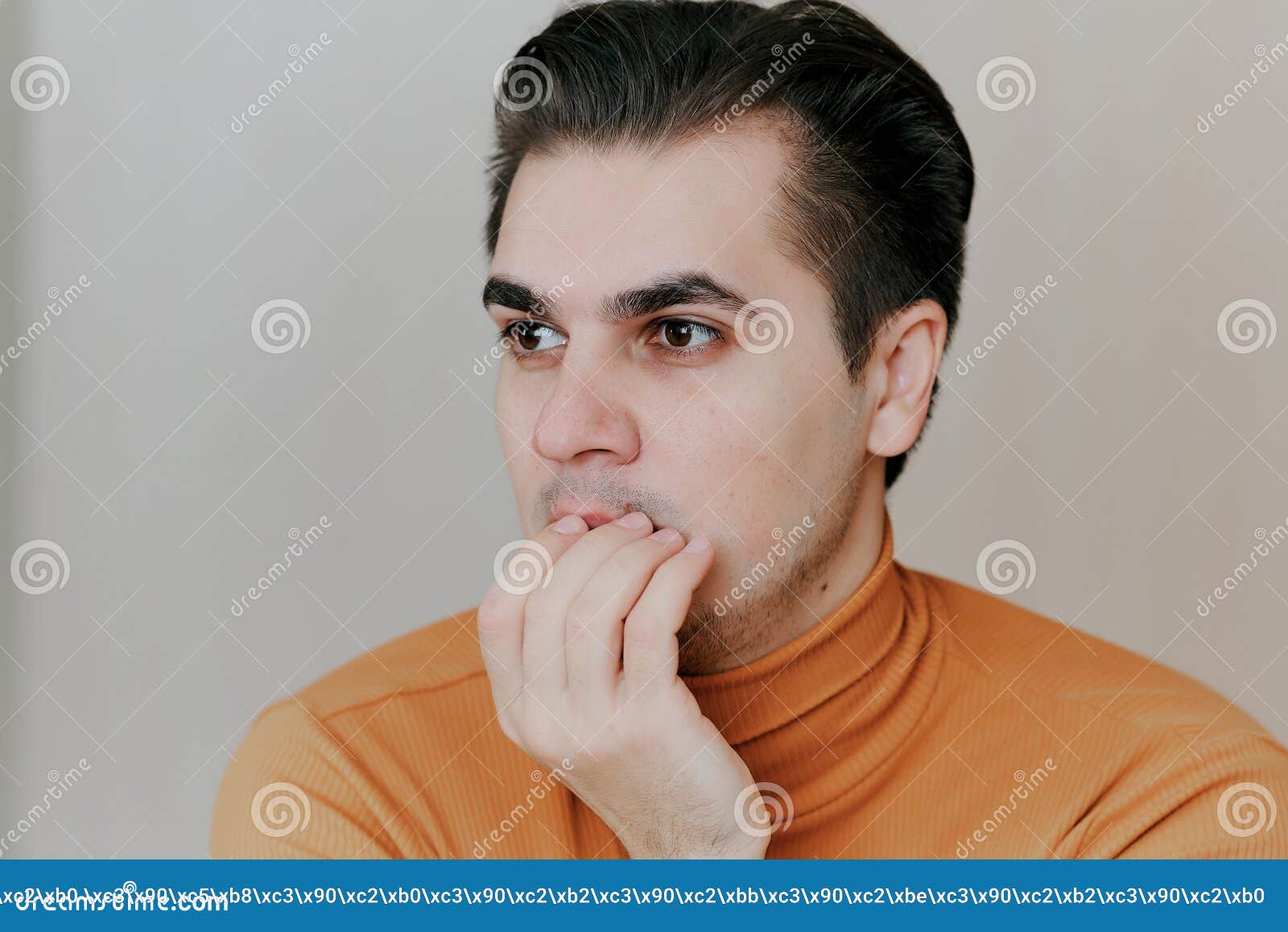 Portrait of a Young Man. the Man Covers His Mouth with His Hand Stock