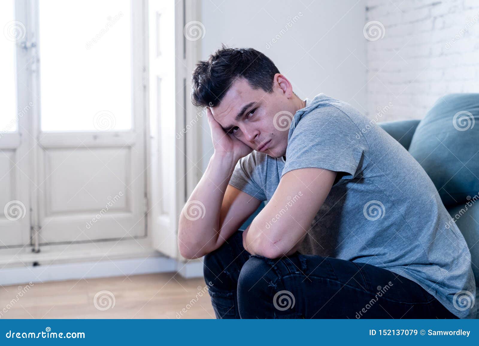 Young Attractive Man Suffering from Depression in Emotional Pain Lying ...