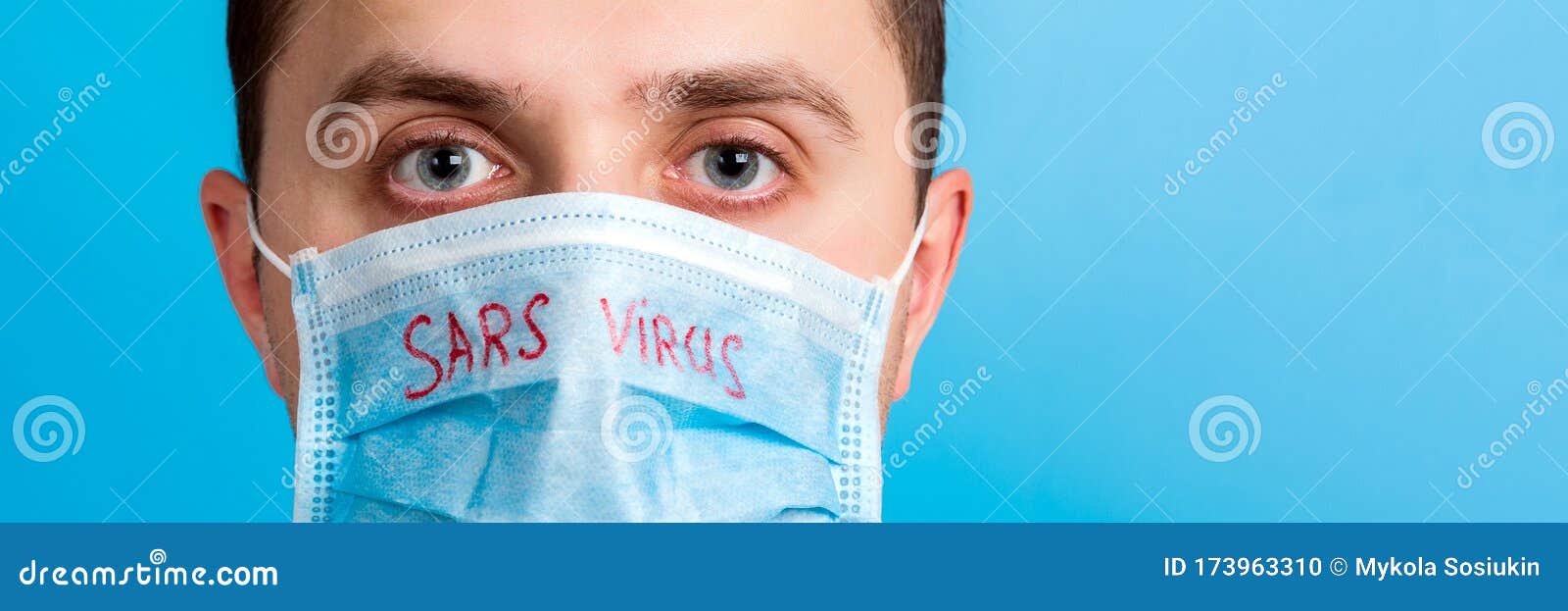 Portrait of Young Man in Protective Mask with SARS Virus Text at Blue ...