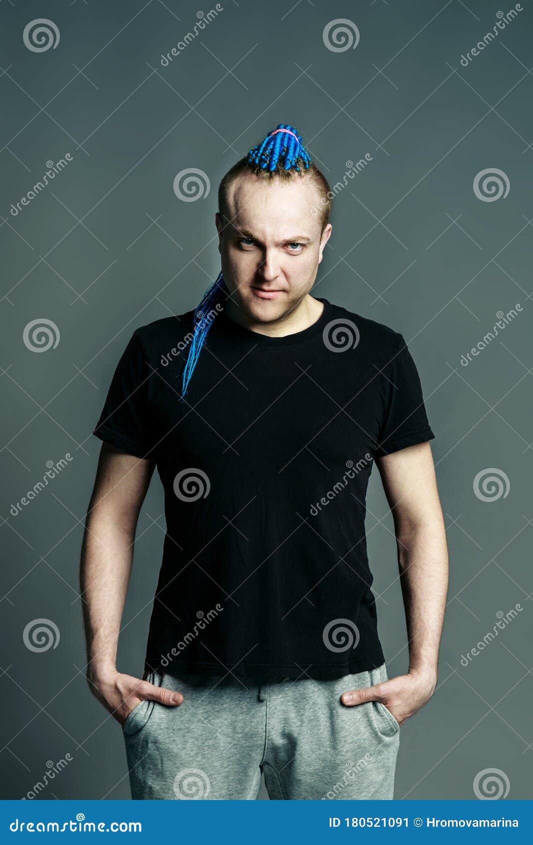 Portrait of a Young Man with an Unusual Hairstyle of Mohawk from Blue  Braids in Sportswear Posing Full-face Stock Image - Image of dreadlocks,  hand: 180521091