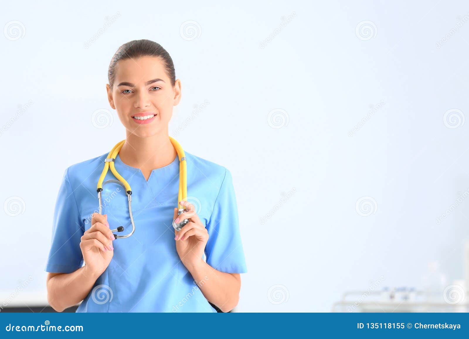 portrait of young medical assistant with stethoscope in hospital.