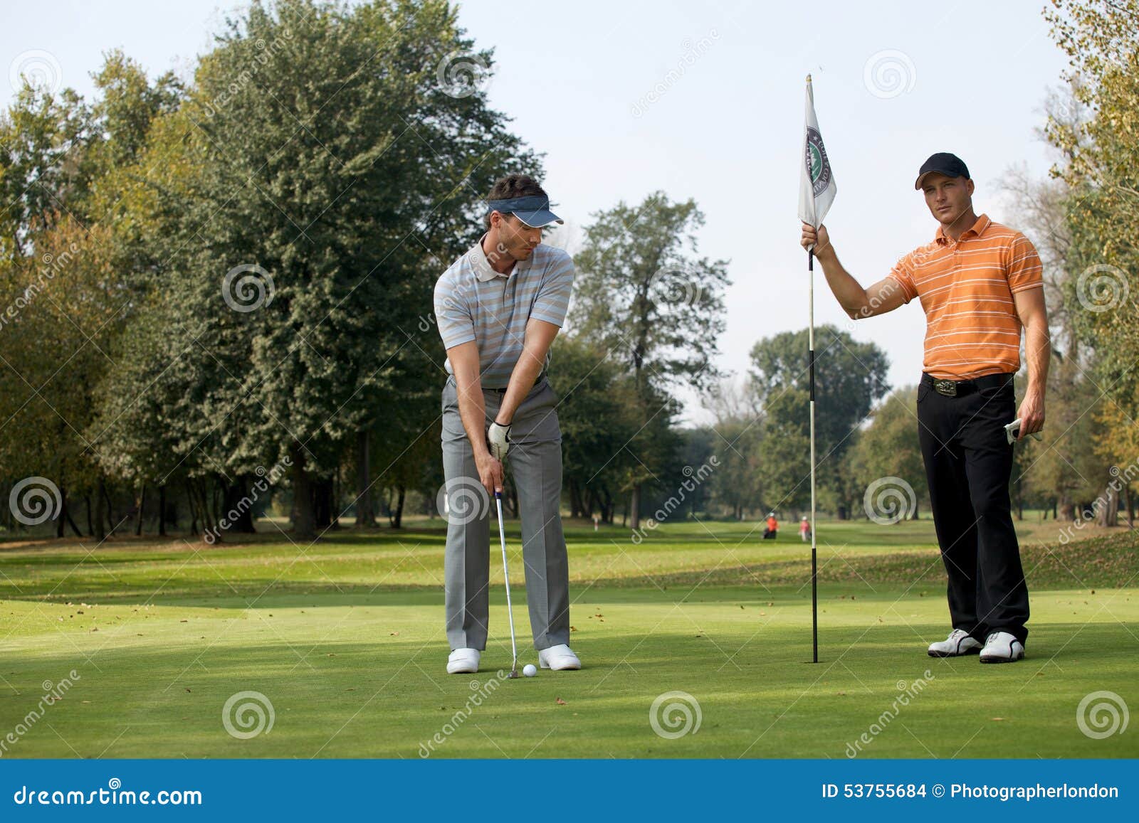 Portrait of Young Men Standing with Golf Sticks on Golf Course Stock Photo Image of golf