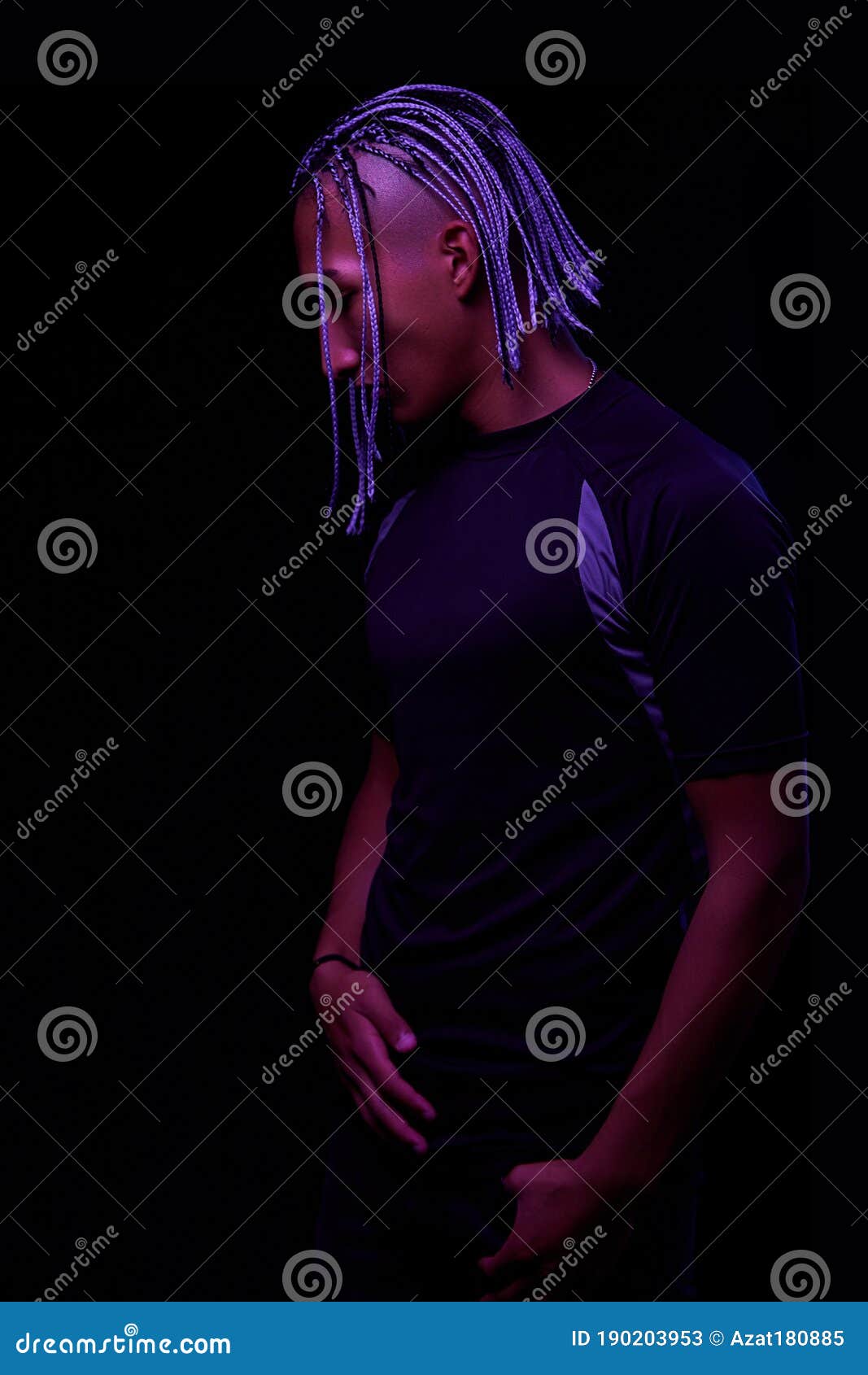 Portrait Of A Young Naked African Man At Studio. High Fashion Male Model In Colorful Neon Bright 