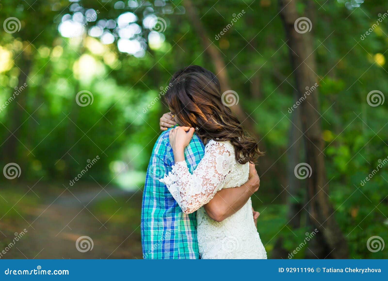 Portrait Of A Young Romantic Couple Embracing Each Other On Nature