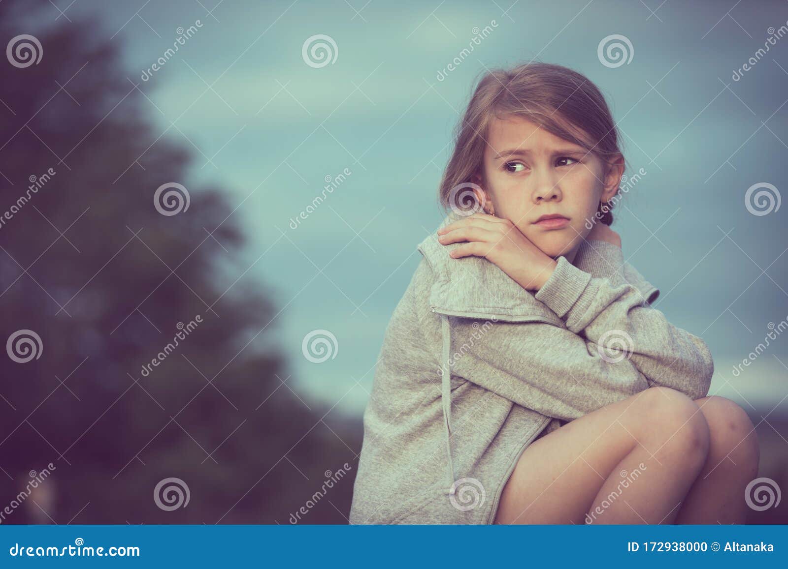 Portrait of Young Sad Girl Sitting Outdoors on the Railway Stock ...