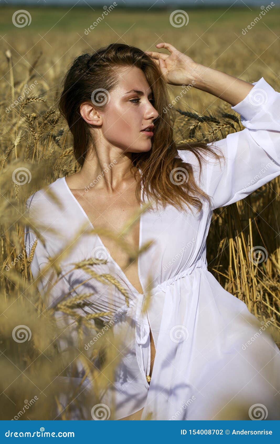 Portrait of sexy young Caucasian woman sitting on rocky coast with breasts  exposed, Stock Photo, Picture And Royalty Free Image. Pic. LPX-U21736378