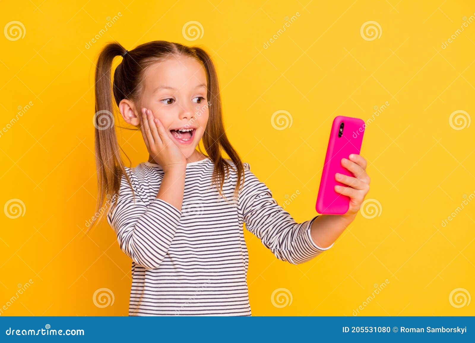 Portrait of Young Surprised Amazed Little Girl Child Kid Hold Cellphone ...