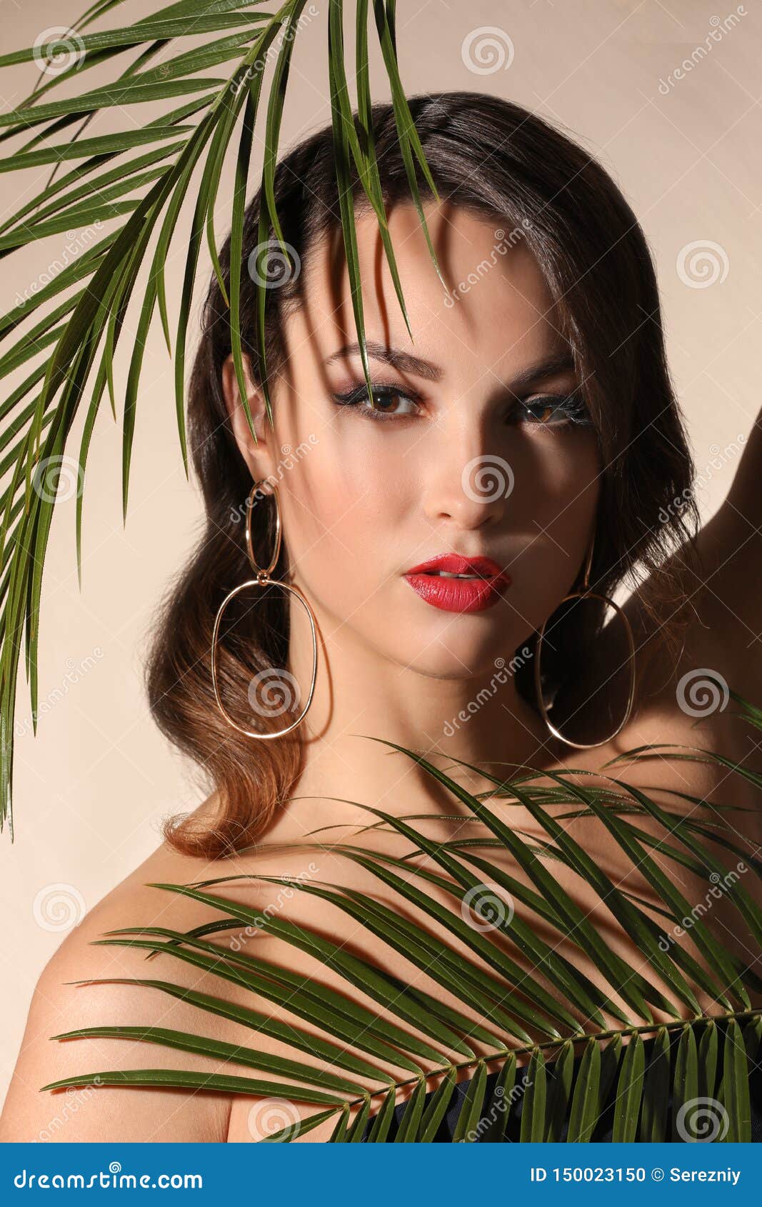 Portrait Of Young Woman With Beautiful Professional Makeup And Palm 