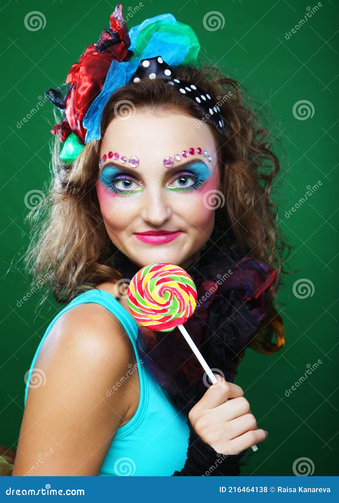 Portrait Of Young Woman In Carnaval Dress With Creative Make Up Holding