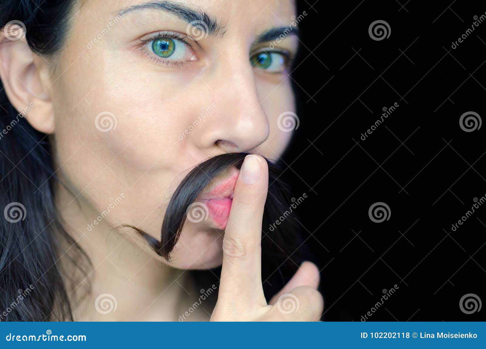 Portrait of a Young Woman with Dark Hair Has Put a Strand of Her Hair on Her Upper Lip. Stock Photo - Image of dark, hair: 102202118 Portrait of a Young Woman with Dark Hair Has Put a Strand of Her Hair on Her Upper Lip. Stock Photo - Image of dark, hair: 102202118