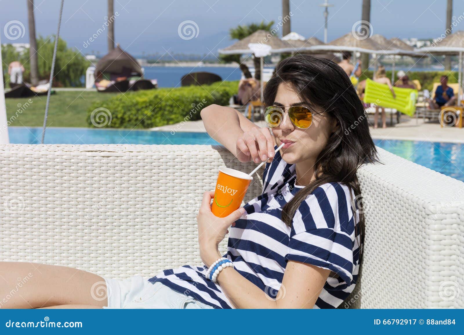Portrait of Young Woman Drinking Juice on the Pool Stock Image - Image ...