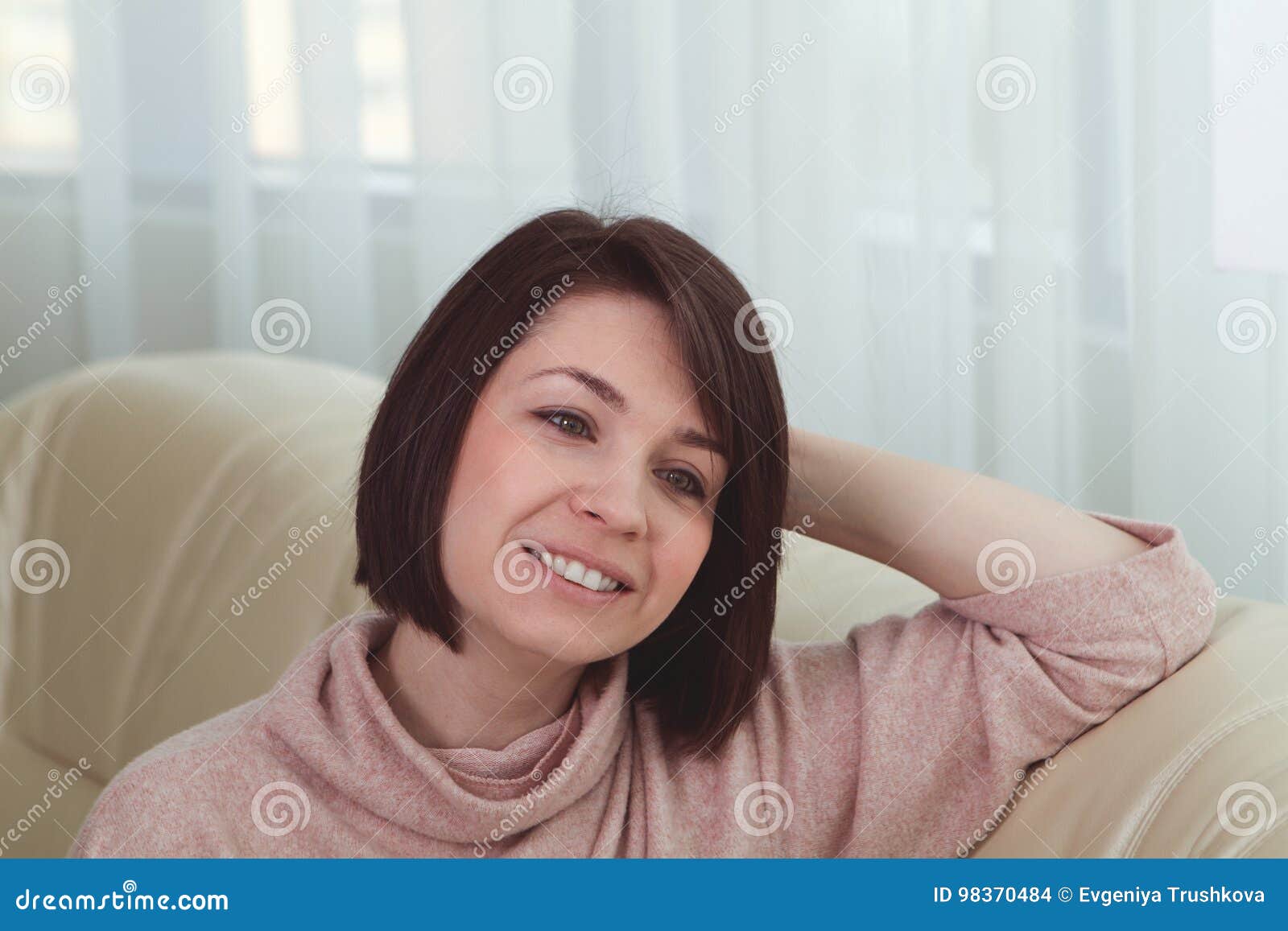 Woman On Couch In Living Room