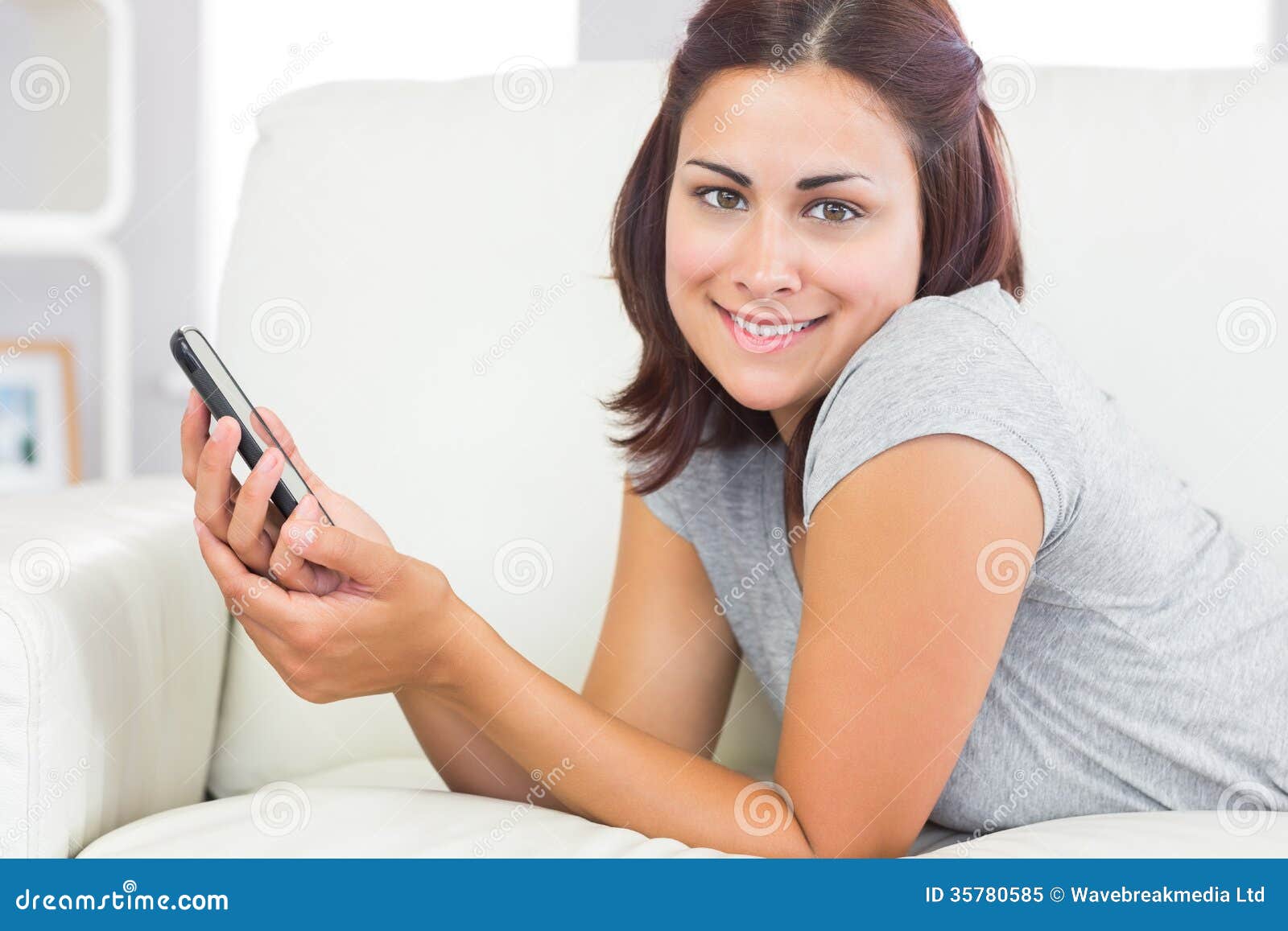 Woman On Couch In Living Room