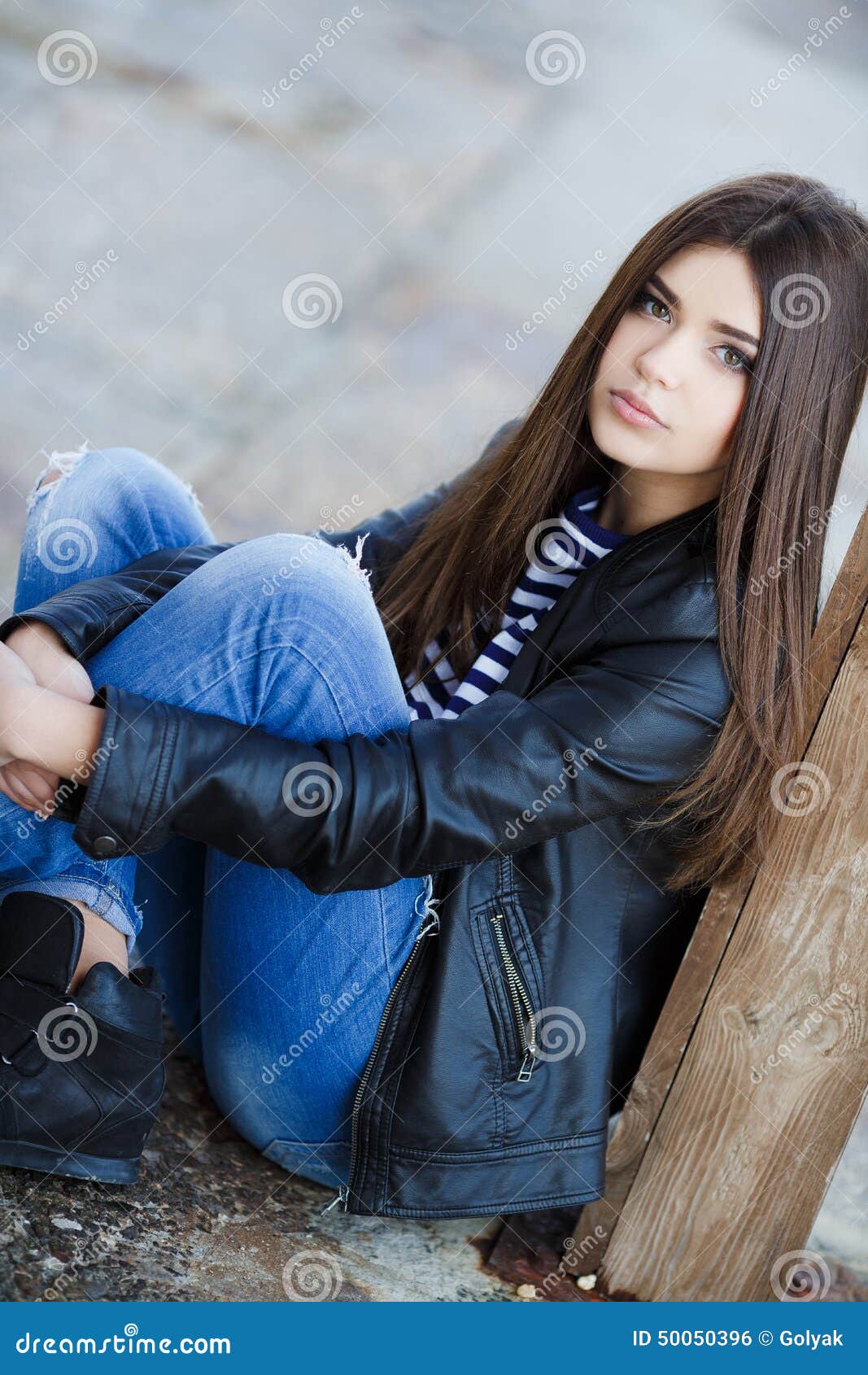 Portrait of a Young Woman Sitting on the Sidewalk. Stock Photo - Image ...