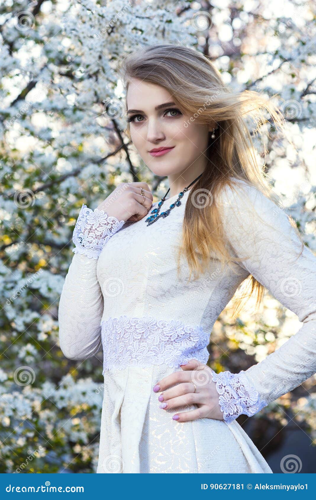 Portrait of Young Woman in White Dress in Spring Flowers. in the Garden ...