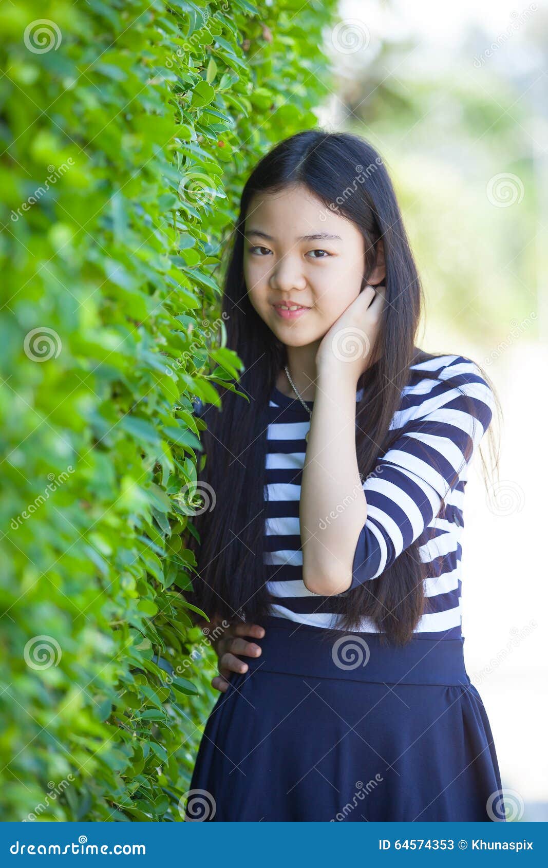 Portrait Of Younger Asian Teen With Happiness Emotion And