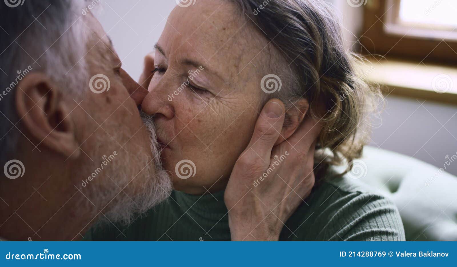 Portraits, an Elderly Man Kisses His Old Wife on the Lips