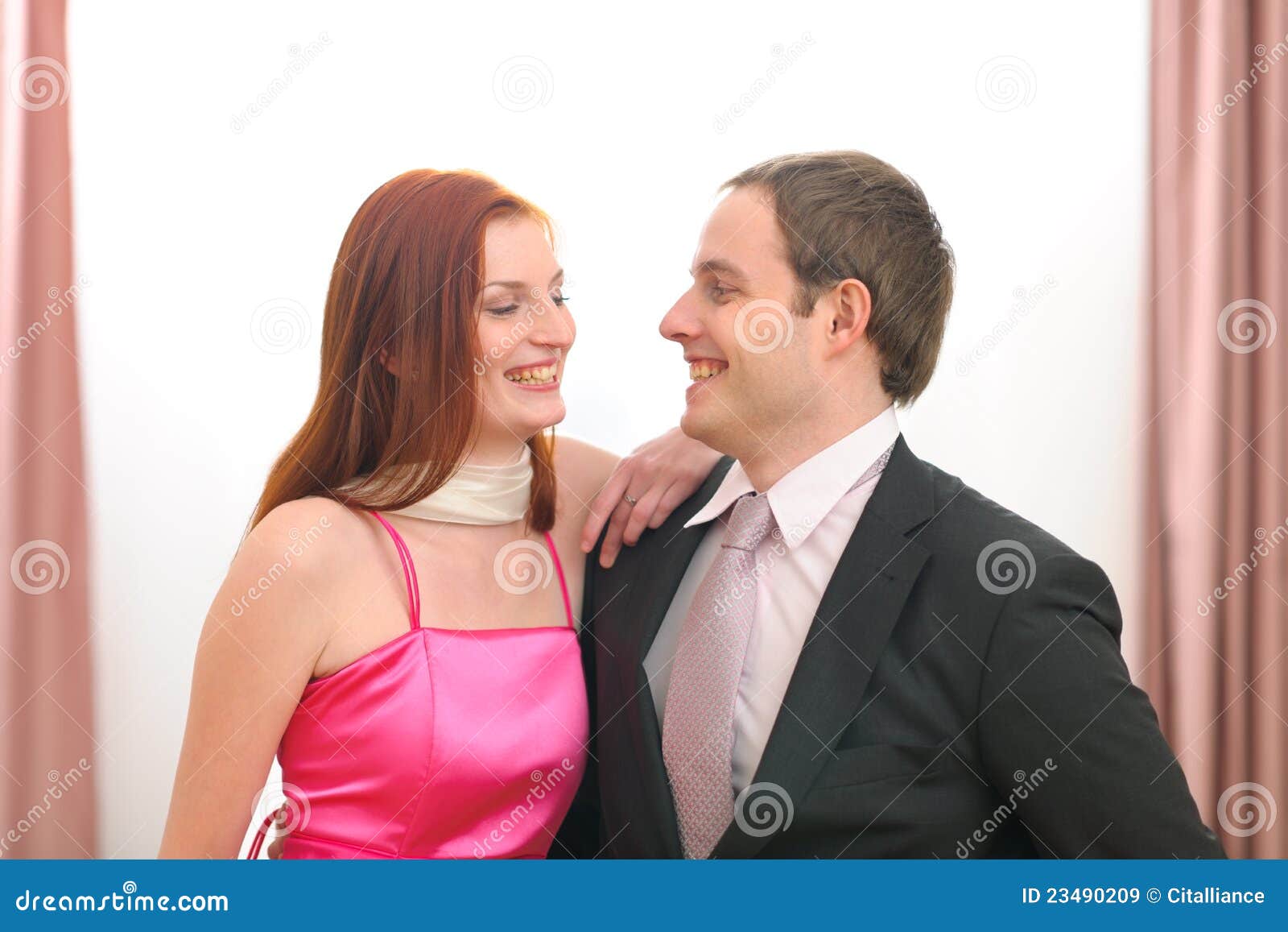 portraits of formally dressed smiling couple