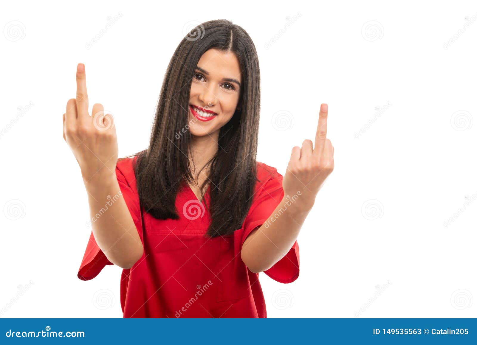 Portrait of beautiful nurse wearing red scrubs showing middle fingers isolated on white background with copy space advertising area