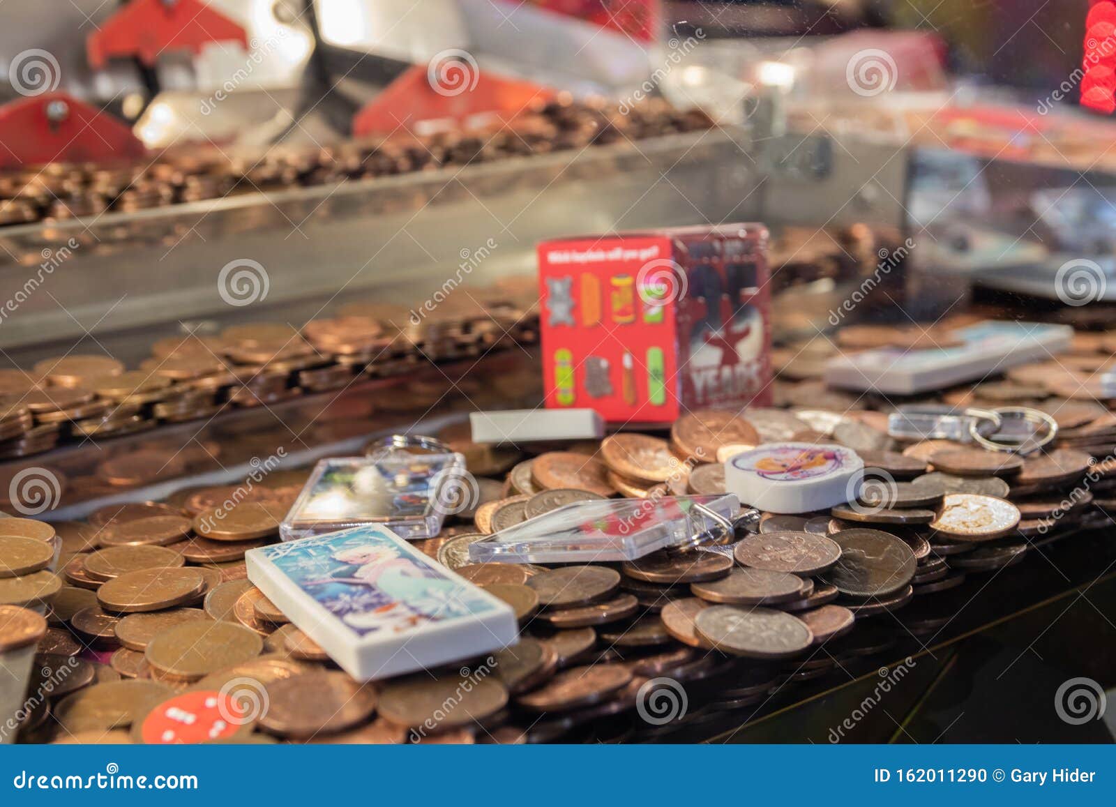 A Close Up Of The Coins On A Coin Push Game At An ...
