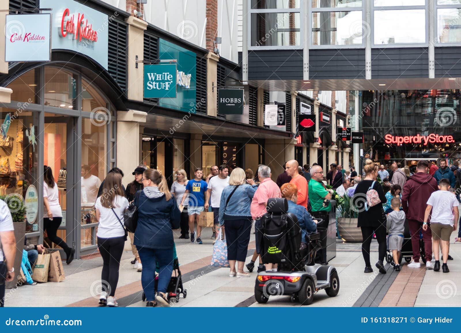 Shoppers Walking Past Shop Windows At A Busy Shopping Centre Editorial Photo Image Of People