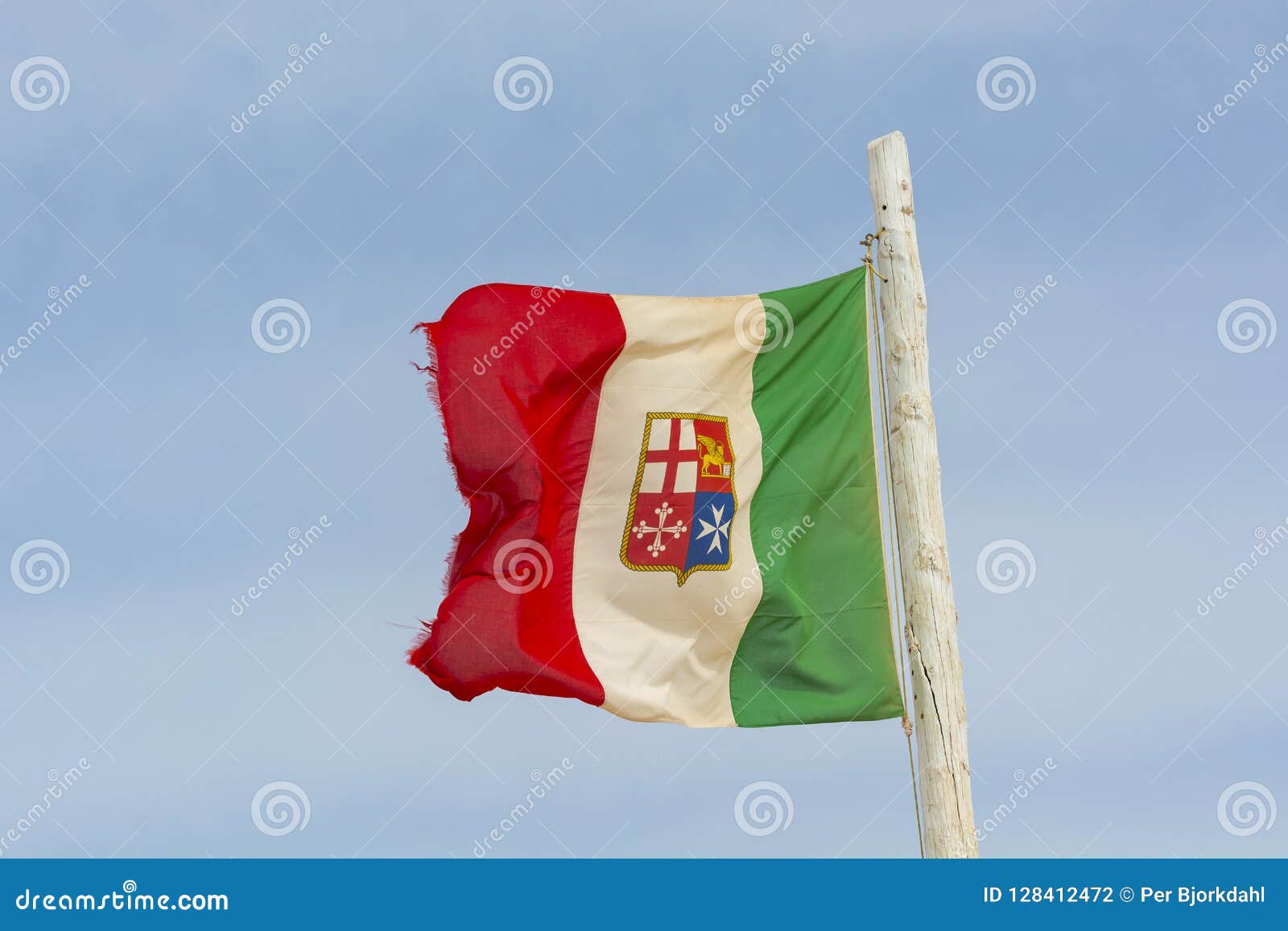 portuguese flag waving dusted with sand in strong vind