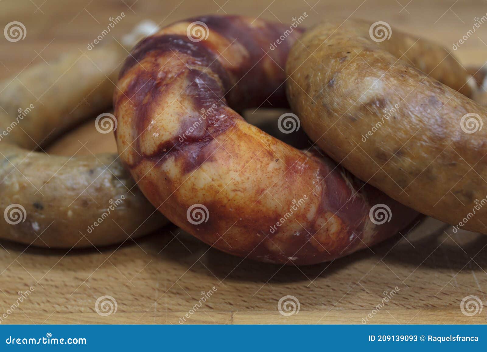 portuguese smoked sausage  alheira and chorizo on wooden board