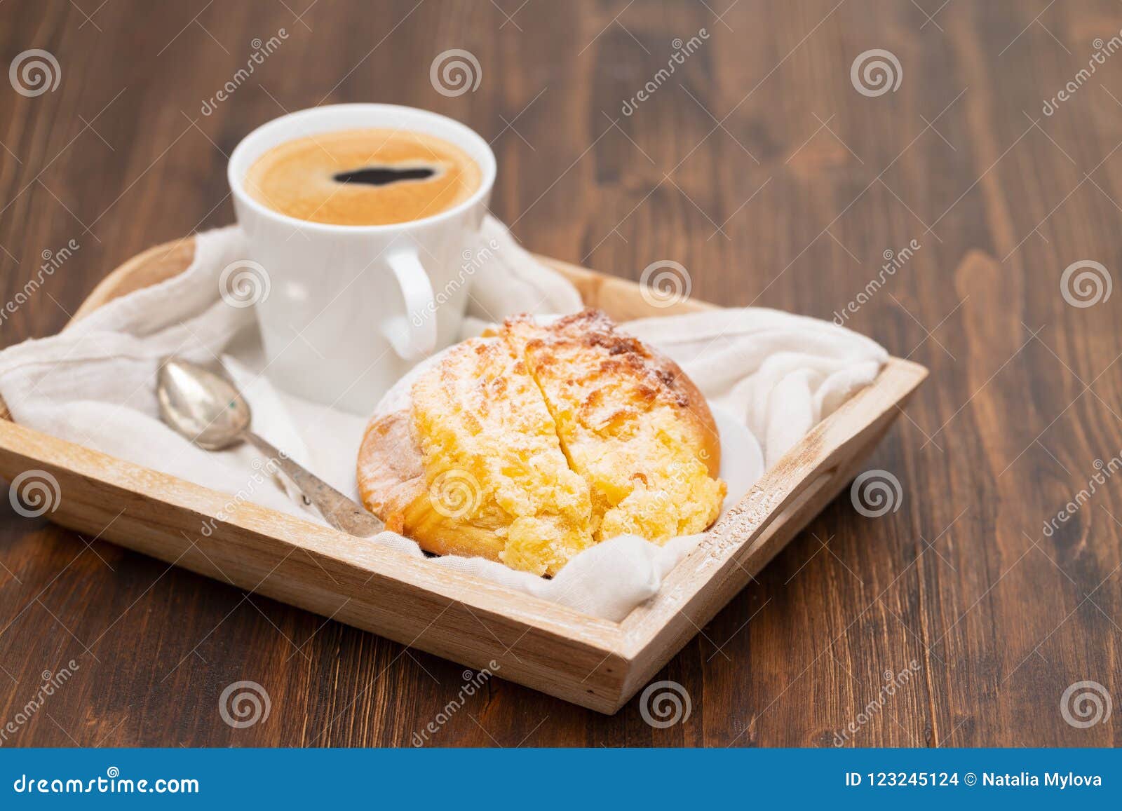 portuguese sweet bread pao de deus with cup of coffee
